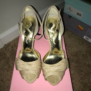 .  Beautiful gold sandals with bow . Worn once.